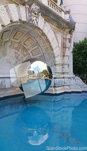 Image of Mirror sphere and a pool in the garden, Monte Carlo, Monaco