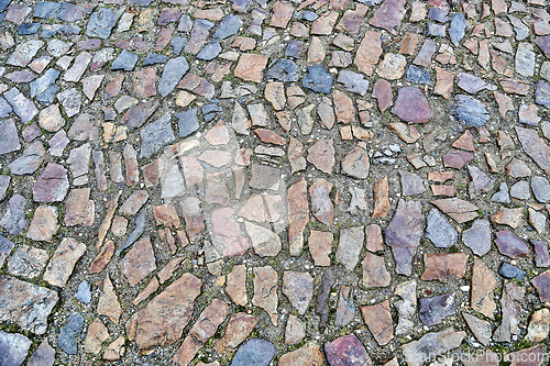 Image of Old pavement of stones of different colors and sizes
