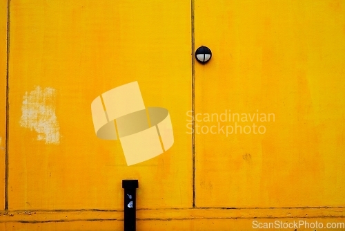 Image of bright yellow building wall surface with room for text 