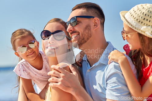 Image of happy family on summer beach