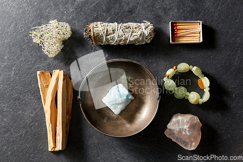 Image of various staff for magic ritual on slate background