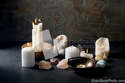 Image of burning candles and crystals for magic ritual