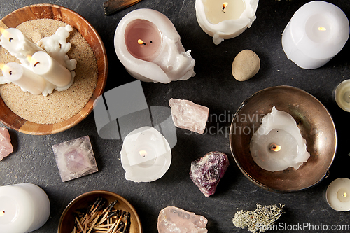 Image of burning candles and crystals for magic ritual