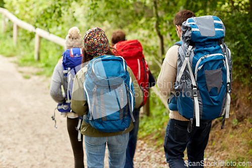 Image of group of friends with backpacks hiking