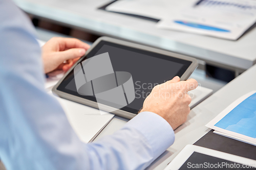 Image of businessman with tablet pc computer at office