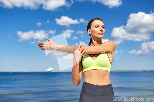 Image of young woman doing sports outdoors