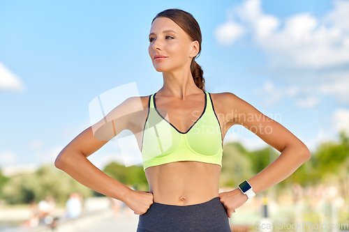 Image of portrait of young sporty woman outdoors