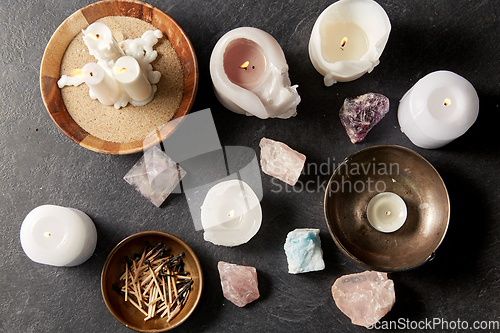 Image of burning candles and crystals for magic ritual