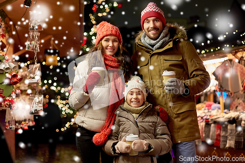 Image of family with takeaway drinks at christmas market