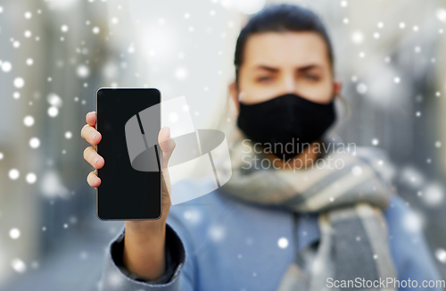 Image of woman wearing protective reusable barrier mask