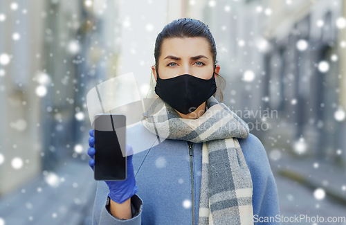 Image of woman wearing protective reusable barrier mask