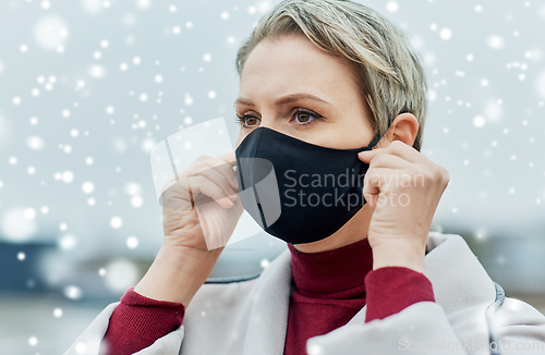 Image of woman wearing protective reusable barrier mask