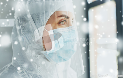 Image of doctor in protective wear, mask and face shield