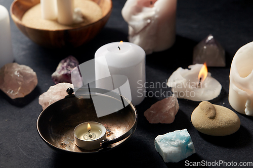 Image of burning candles and crystals for magic ritual