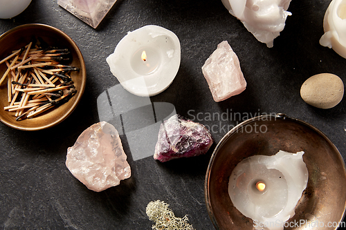 Image of burning candles and crystals for magic ritual