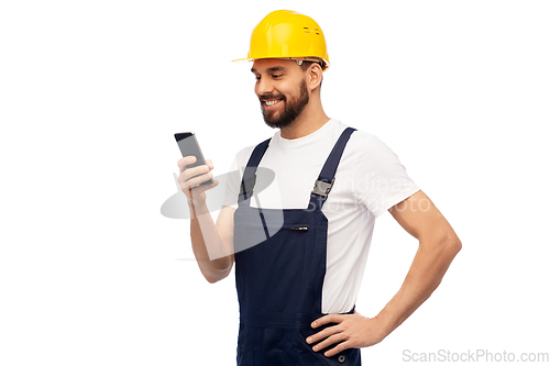 Image of happy male worker or builder with smartphone