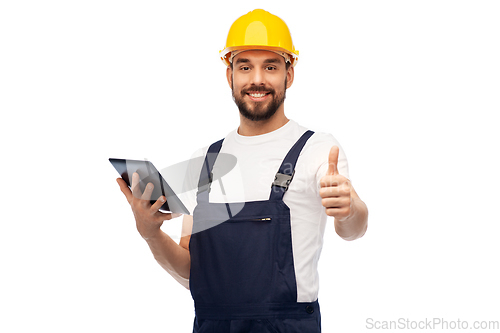 Image of worker or builder with tablet pc showing thumbs up