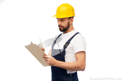 Image of male worker or builder in helmet with clipboard