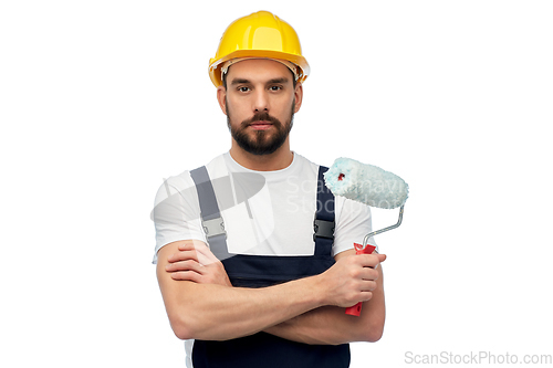 Image of male worker or builder with paint roller