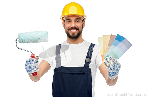 Image of male builder with paint roller and color palettes