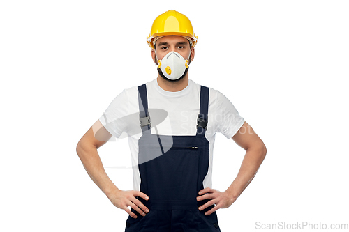 Image of male worker or builder in helmet and respirator