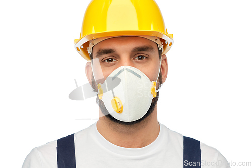 Image of male worker or builder in helmet and respirator