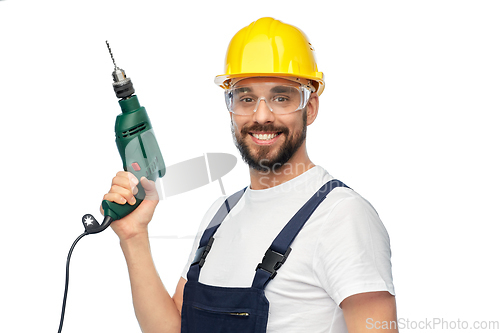 Image of happy male worker or builder in helmet with drill