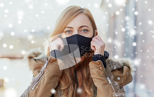 Image of woman wearing protective reusable barrier mask