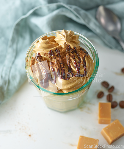 Image of glass of whipped coffee and caramel mousse cream