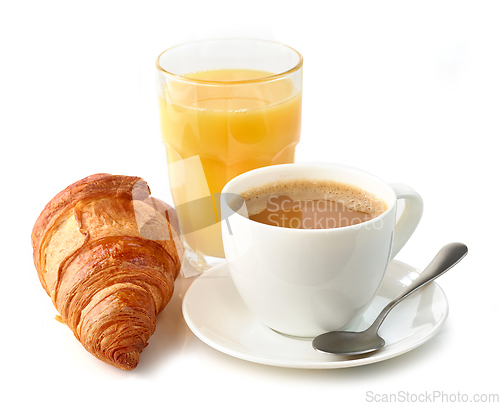 Image of coffee with milk, croissant and orange juice