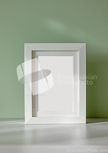 Image of white frame on green background