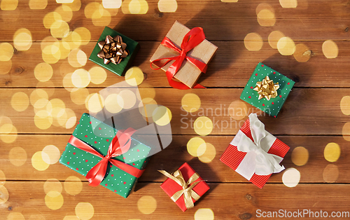 Image of christmas gifts on wooden boards