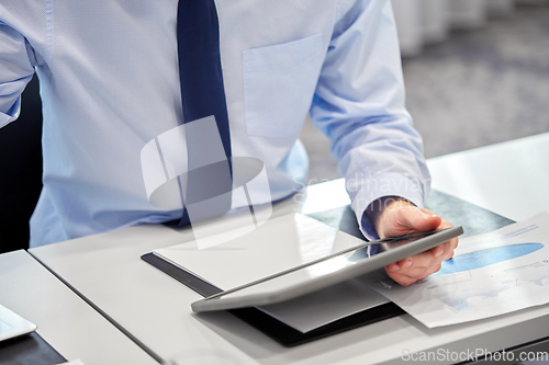Image of businessman with tablet pc computer at office