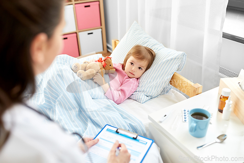 Image of doctor with clipboard and sick girl in bed at home