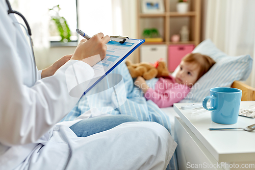 Image of doctor with clipboard and sick girl in bed at home