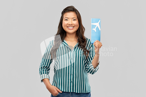 Image of happy asian woman with air ticket and passport