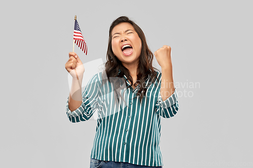 Image of happy asian woman with flag of america