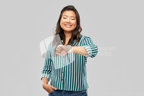 Image of happy smiling woman with smart watch