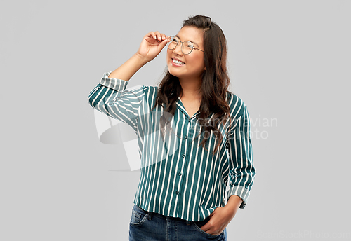 Image of happy asian woman in glasses or student