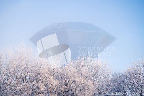 Image of Futuristic water supply tower on cold morning