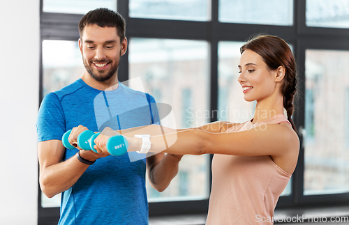 Image of happy couple exercising at home