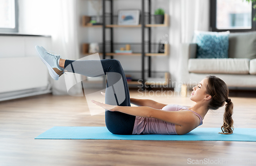 Image of woman exercising at home
