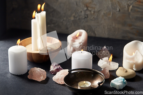 Image of burning candles and crystals for magic ritual