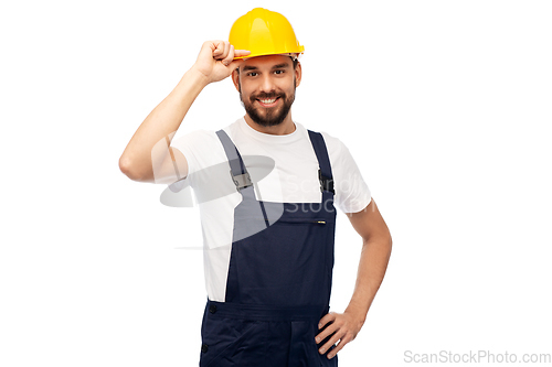 Image of happy smiling male worker or builder in helmet