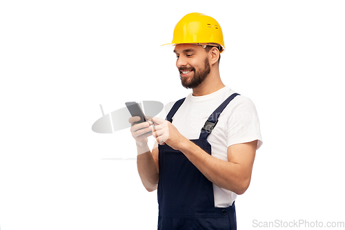 Image of happy male worker or builder with smartphone