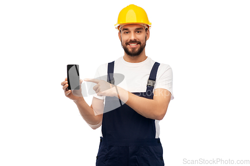 Image of happy male worker or builder showing smartphone