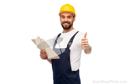 Image of worker or builder with clipboard showing thumbs up