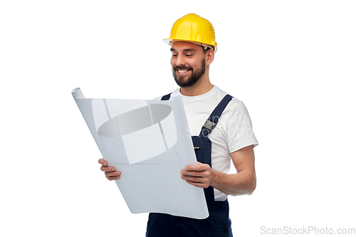 Image of male worker or builder in helmet with blueprint