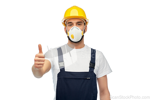 Image of male worker or builder in helmet and respirator