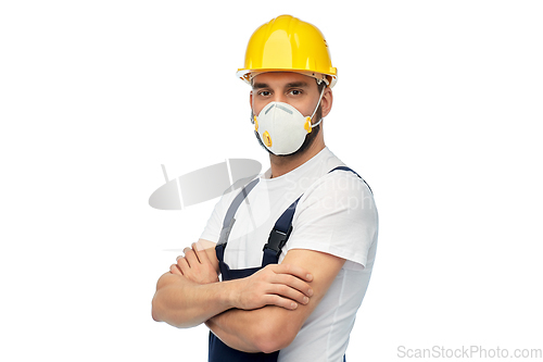 Image of male worker or builder in helmet and respirator